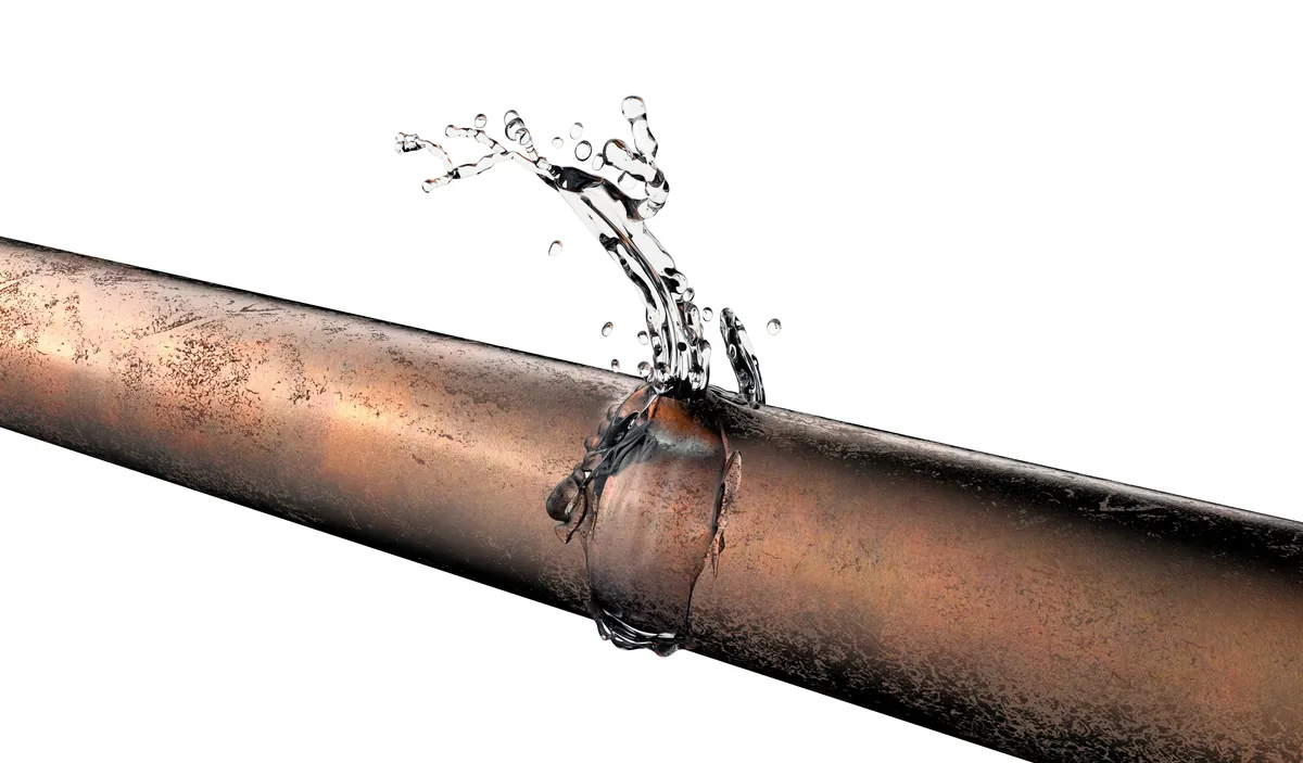 Pinhole leak spraying from a copper pipe, from our Irvine guide: Leak Detection Orange County Guide for Irvine Properties