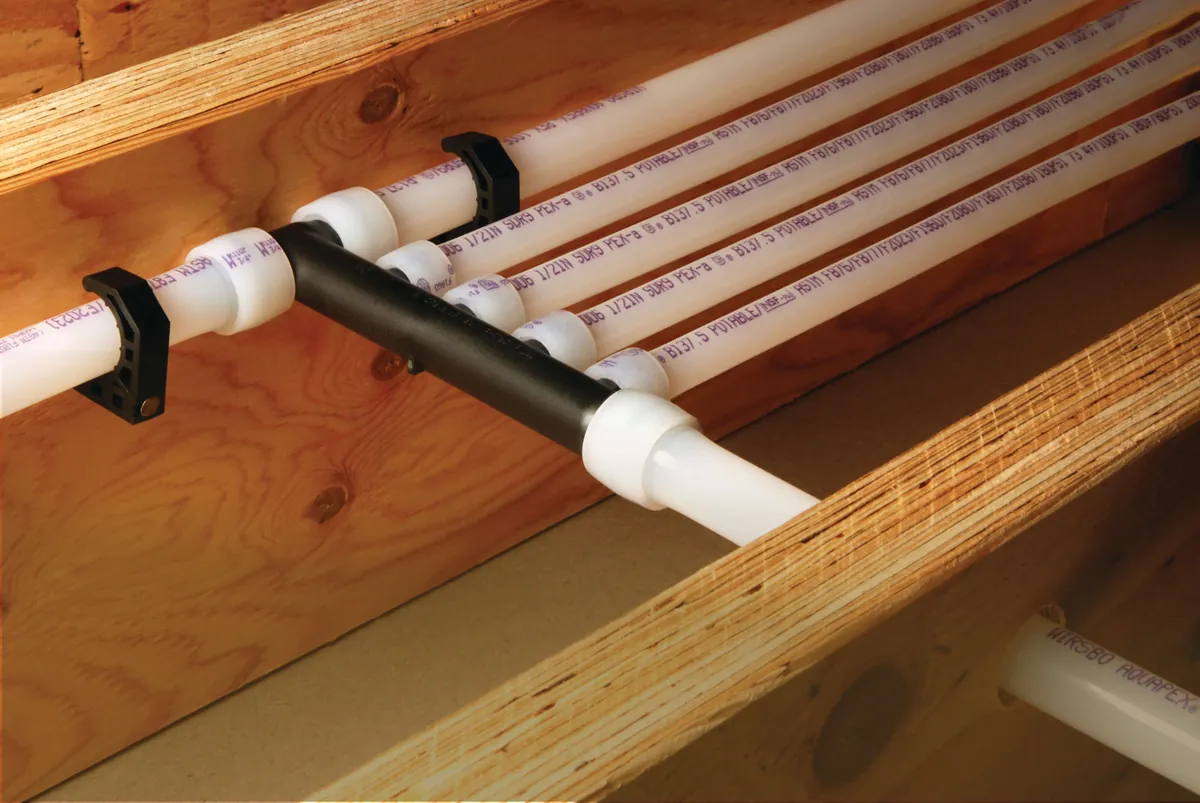 PEX-A multiport tee distributing water lines along joists – Whole House Water Filtration System Installation for Irvine, CA homes